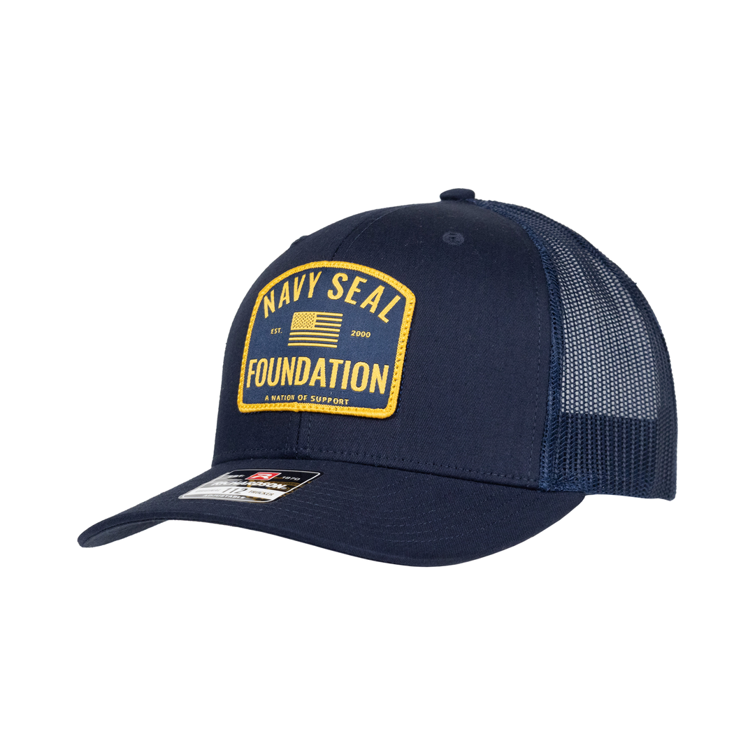 Navy hat with yellow and navy patch with text "NAVY SEAL FOUNDATION" and American flag