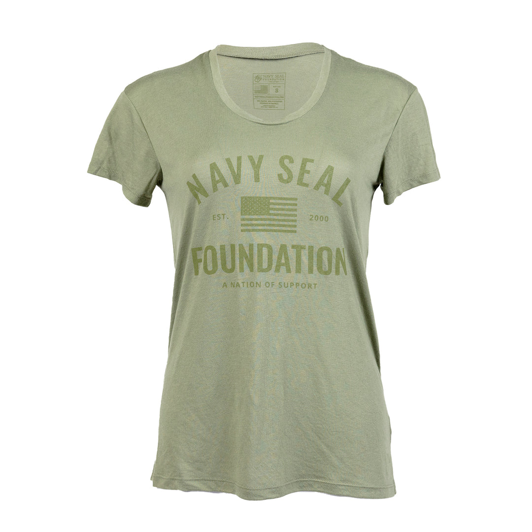 Military Green Ladies tee with text "NAVY SEAL FOUNDATION A NATION OF SUPPORT EST 2000" with graphic of American Flag