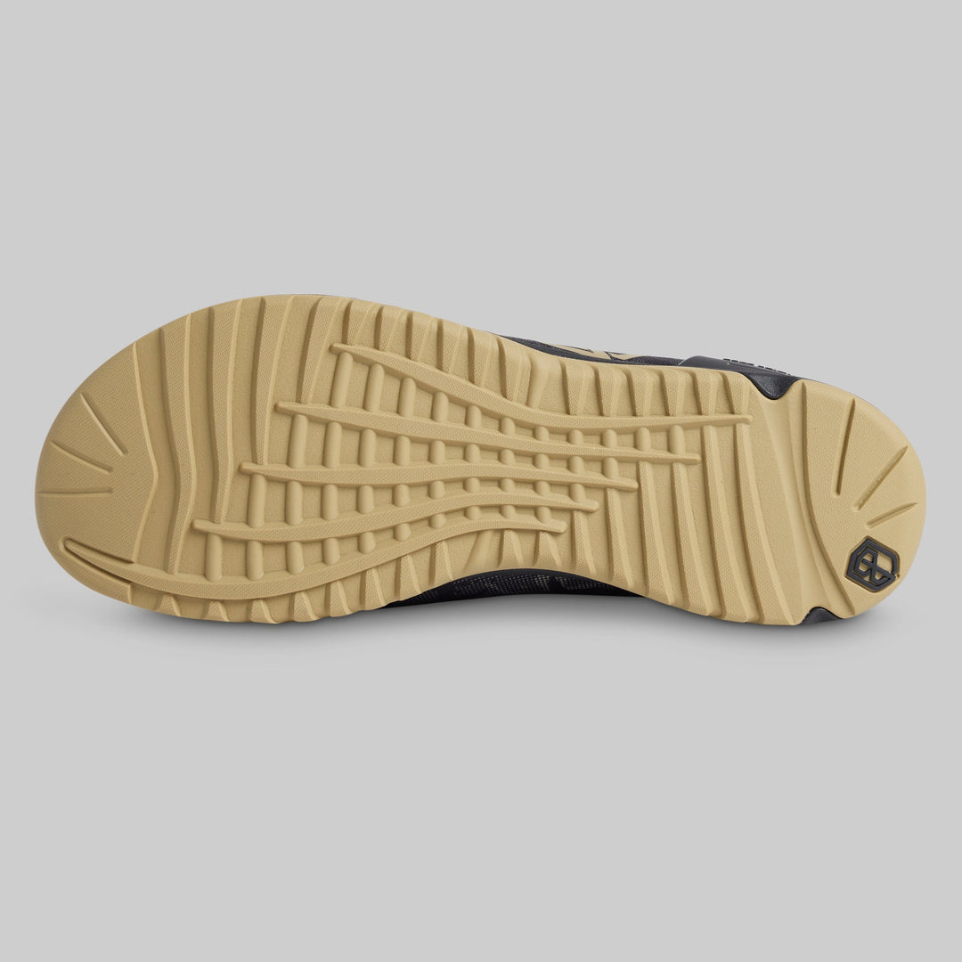 Tan and black outsole tread of the NSF Edition Savage 1